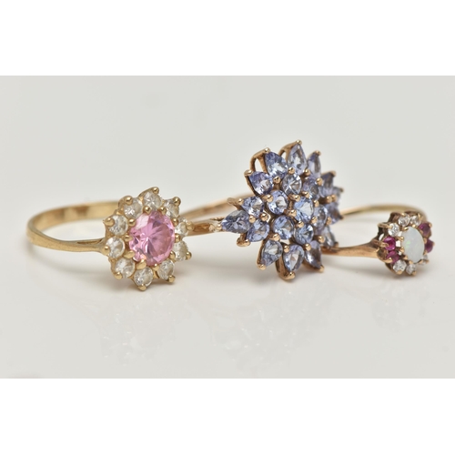 47 - THREE GEM SET RINGS, to include a tanzanite cluster ring, prong set in yellow gold, hallmarked 9ct B... 