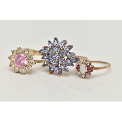 47 - THREE GEM SET RINGS, to include a tanzanite cluster ring, prong set in yellow gold, hallmarked 9ct B... 