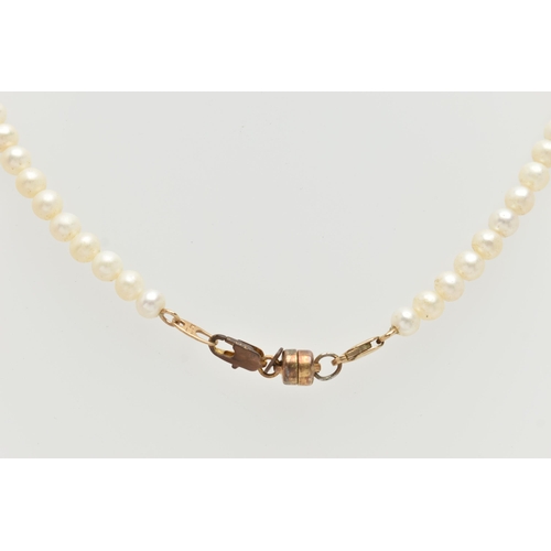 61 - A SINGLE STRAND CULTURED PEARL AND DIAMOND PENDANT NECKLACE, a single strand of cultured white pearl... 