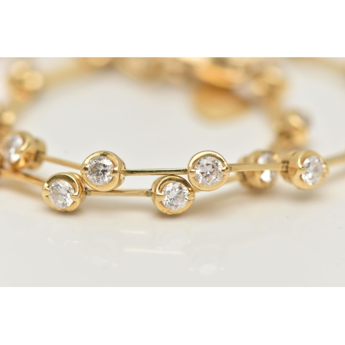 70 - A DIAMOND LINE BRACELET, yellow metal line bracelet, twenty three round brilliant cut diamonds, inte... 