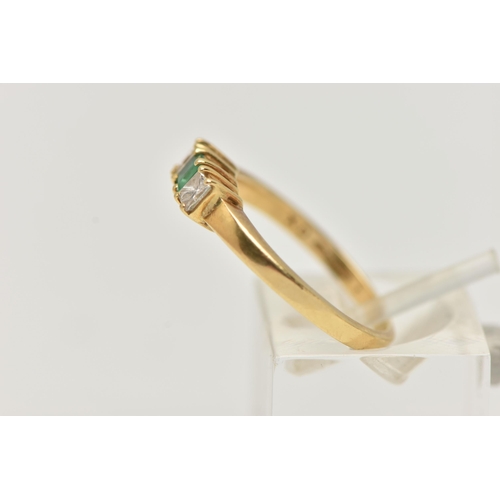 71 - AN 18CT GOLD EMERALD AND DIAMOND THREE STONE RING, two princess cut diamonds set either side of a sq... 