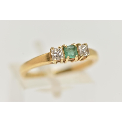 71 - AN 18CT GOLD EMERALD AND DIAMOND THREE STONE RING, two princess cut diamonds set either side of a sq... 