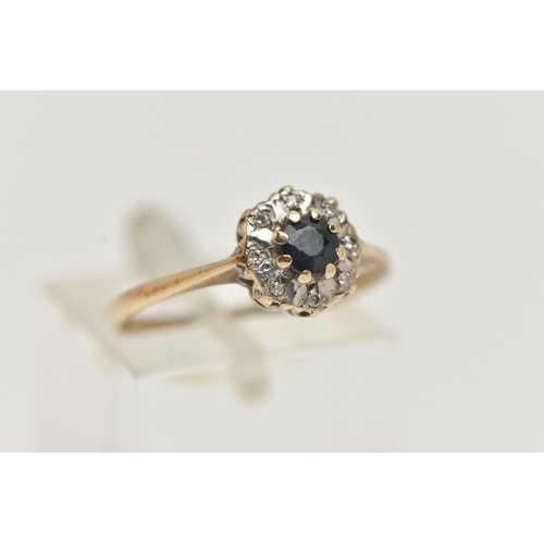 72 - A 9CT GOLD DIAMOND AND SAPPHIRE RING, a circular cut blue sapphire, prong set with eight single cut ... 