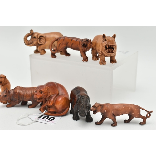 100 - EIGHT 20TH CENTURY CARVED TREEN NETSUKE, carved as rhinos, an elephant, tiger and other large cats, ... 