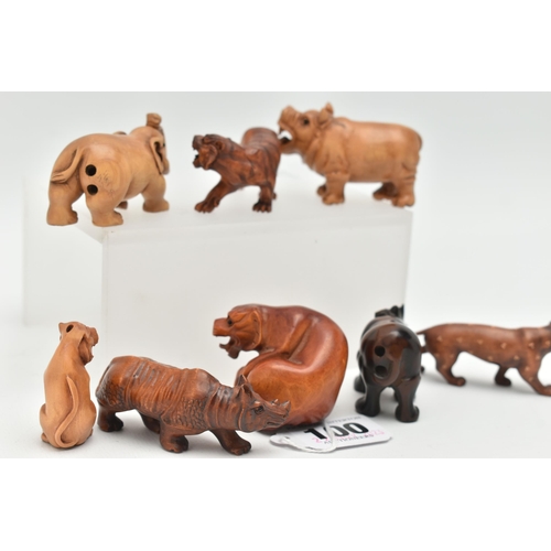 100 - EIGHT 20TH CENTURY CARVED TREEN NETSUKE, carved as rhinos, an elephant, tiger and other large cats, ... 