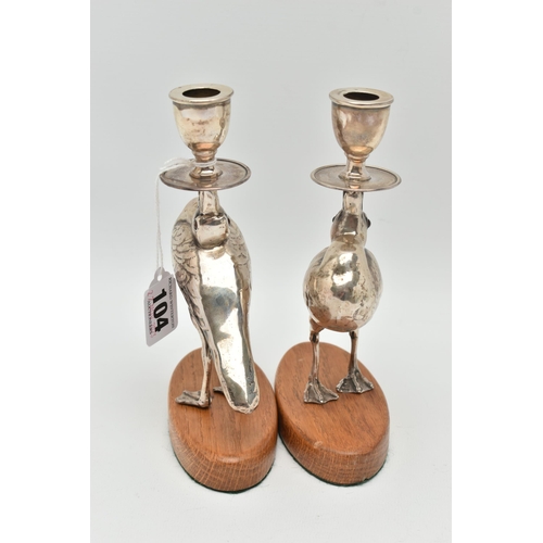 104 - A PAIR OF 'WILLIAM HUTTON & SONS LTD' SILVER CANDLESTICKS, each in the form of a bird set with glass... 