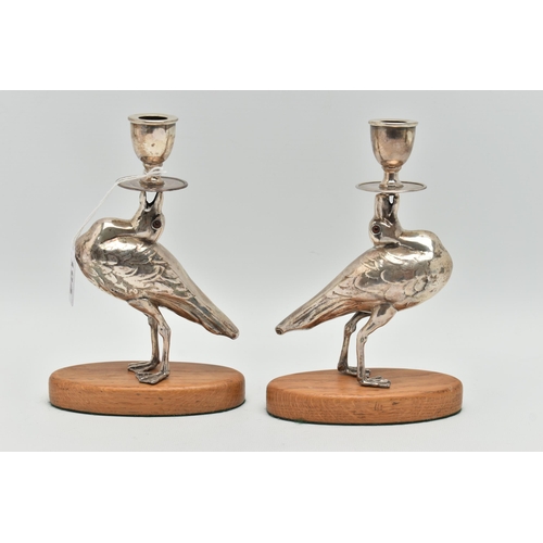 104 - A PAIR OF 'WILLIAM HUTTON & SONS LTD' SILVER CANDLESTICKS, each in the form of a bird set with glass... 