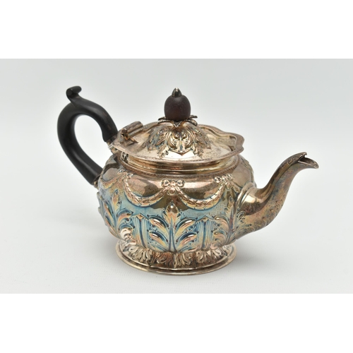 107 - A LATE VICTORIAN SILVER BACHELORS TEA POT OF SQUAT CIRCULAR FORM, repoussé decorated to the domed co... 