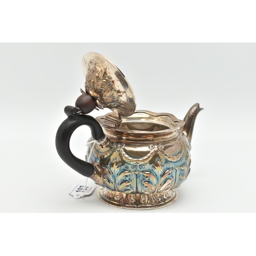 107 - A LATE VICTORIAN SILVER BACHELORS TEA POT OF SQUAT CIRCULAR FORM, repoussé decorated to the domed co... 