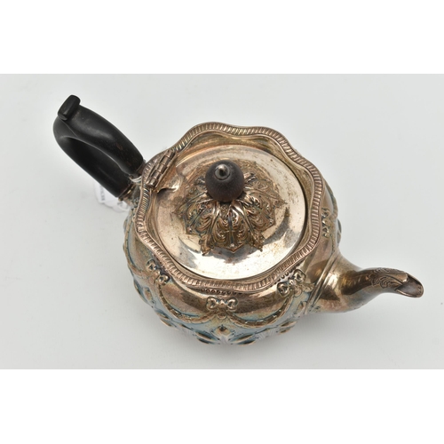 107 - A LATE VICTORIAN SILVER BACHELORS TEA POT OF SQUAT CIRCULAR FORM, repoussé decorated to the domed co... 