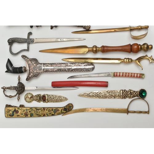 128 - THIRTY SEVEN LETTER OPENERS IN THE FORM OF SWORDS / DAGGERS, including a horn handled white metal ex... 