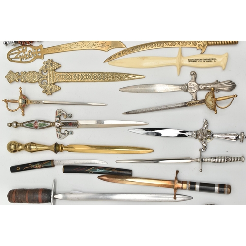 128 - THIRTY SEVEN LETTER OPENERS IN THE FORM OF SWORDS / DAGGERS, including a horn handled white metal ex... 