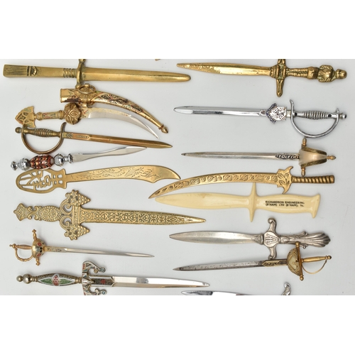 128 - THIRTY SEVEN LETTER OPENERS IN THE FORM OF SWORDS / DAGGERS, including a horn handled white metal ex... 