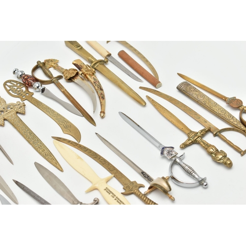 128 - THIRTY SEVEN LETTER OPENERS IN THE FORM OF SWORDS / DAGGERS, including a horn handled white metal ex... 