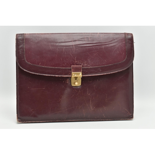 134 - AN 'OMEGA' BURGUNDY LEATHER DOCUMENTATION FOLDER, large rectangular wallet with slide release clasp,... 