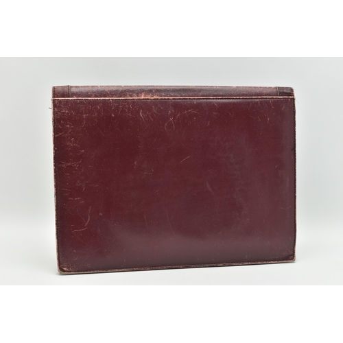 134 - AN 'OMEGA' BURGUNDY LEATHER DOCUMENTATION FOLDER, large rectangular wallet with slide release clasp,... 