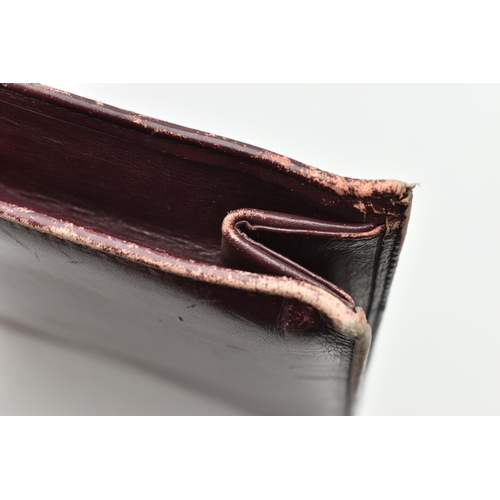 134 - AN 'OMEGA' BURGUNDY LEATHER DOCUMENTATION FOLDER, large rectangular wallet with slide release clasp,... 