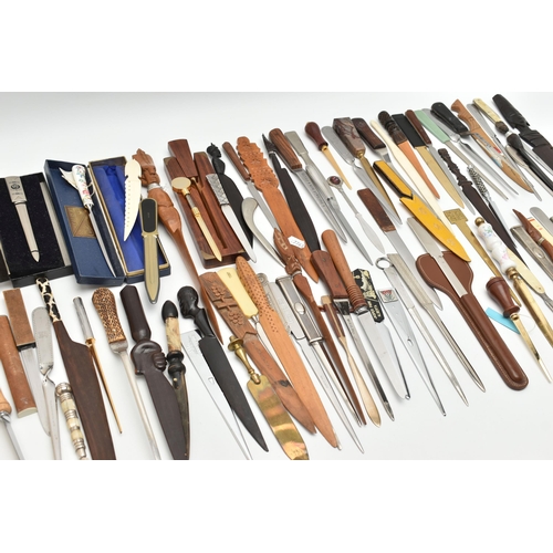 136 - APPROXIMATELY EIGHTY ASSORTED LETTER OPENERS IN TREEN, PLASTIC AND ASSORTED BASE METALS, includes a ... 