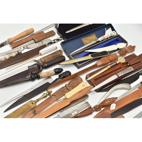 136 - APPROXIMATELY EIGHTY ASSORTED LETTER OPENERS IN TREEN, PLASTIC AND ASSORTED BASE METALS, includes a ... 