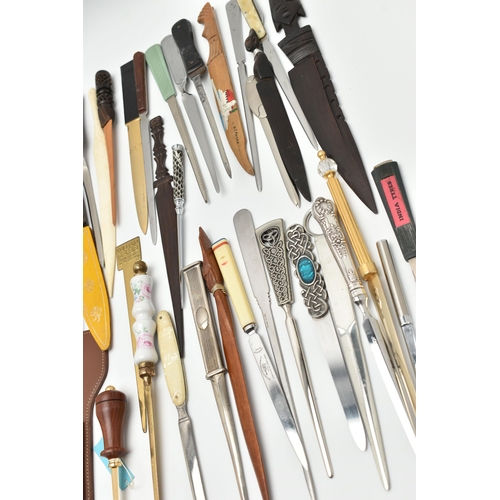 136 - APPROXIMATELY EIGHTY ASSORTED LETTER OPENERS IN TREEN, PLASTIC AND ASSORTED BASE METALS, includes a ... 