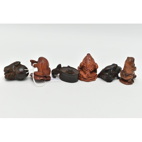 91 - SIX 20TH CENTURY CARVED TREEN NETSUKE, all in the form of frogs / toads, three with inset eyes, four... 