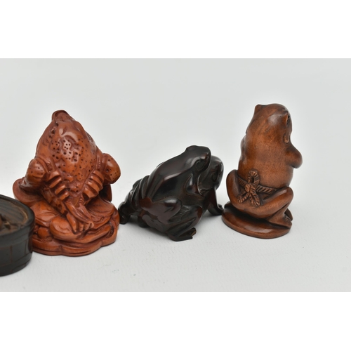 91 - SIX 20TH CENTURY CARVED TREEN NETSUKE, all in the form of frogs / toads, three with inset eyes, four... 