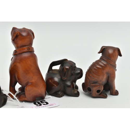 95 - FOUR 20TH CENTURY CARVED TREEN NETSUKE AND TWO OKIMONO, all in the form of dogs, five with inset eye... 