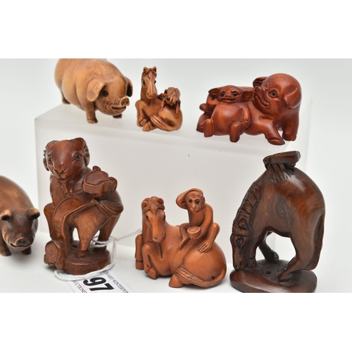 97 - SIX 20TH CENTURY CARVED TREEN NETSUKE AND AN OKIMONO, carved as pigs, horses, goat, etc, all with in... 