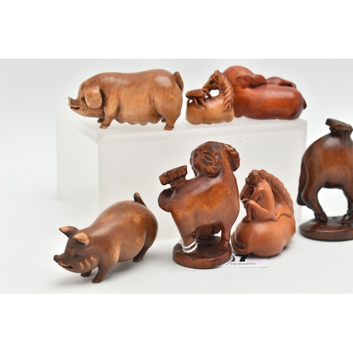 97 - SIX 20TH CENTURY CARVED TREEN NETSUKE AND AN OKIMONO, carved as pigs, horses, goat, etc, all with in... 