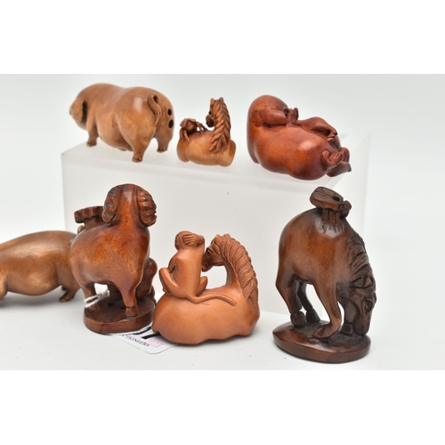 97 - SIX 20TH CENTURY CARVED TREEN NETSUKE AND AN OKIMONO, carved as pigs, horses, goat, etc, all with in... 