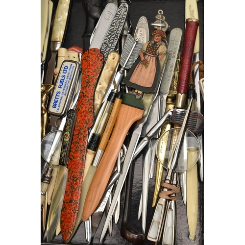 145 - A BOX OF NOVELTY, COMMEMORATIVE AND SOUVENIR LETTER OPENERS IN TREEN, CERAMIC, ASSORTED METALS, some... 