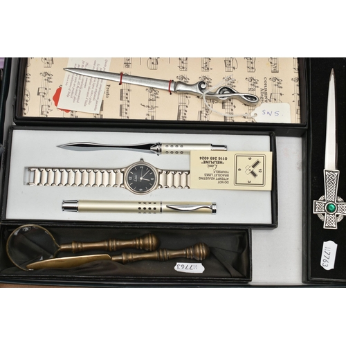 145 - A BOX OF NOVELTY, COMMEMORATIVE AND SOUVENIR LETTER OPENERS IN TREEN, CERAMIC, ASSORTED METALS, some... 