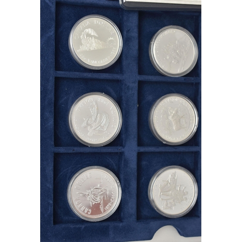 155 - A WESTMINSTER BOXED AMOUNT OF MAINLY SILVER ROYAL CANADIAN MINT COINS, to include 13x 36mm or 38mm S... 