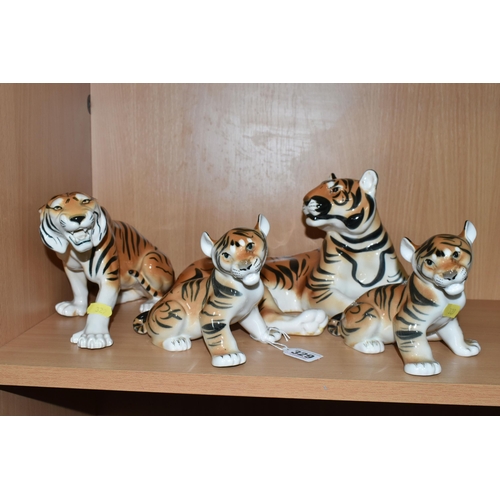 329 - A GROUP OF LOMONOSOV TIGERS, comprising a large recumbent tiger, height 17cm x length 30cm (remnants... 