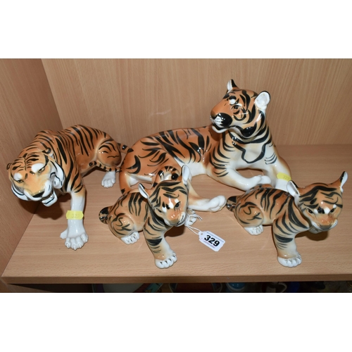 329 - A GROUP OF LOMONOSOV TIGERS, comprising a large recumbent tiger, height 17cm x length 30cm (remnants... 