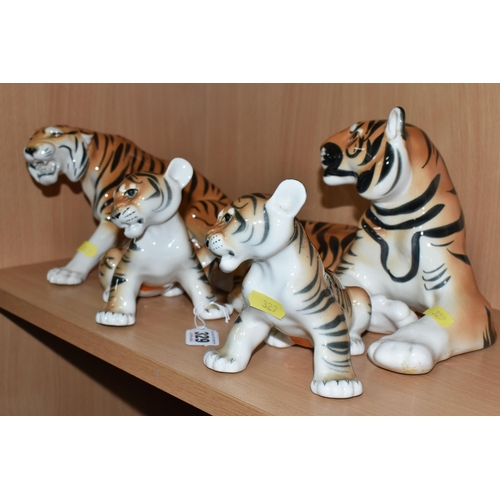 329 - A GROUP OF LOMONOSOV TIGERS, comprising a large recumbent tiger, height 17cm x length 30cm (remnants... 