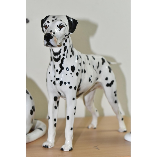 345 - A BESWICK DALMATIAN AND TWO ROYAL DOULTON FIGURES, comprising a large Beswick Fireside Models seated... 