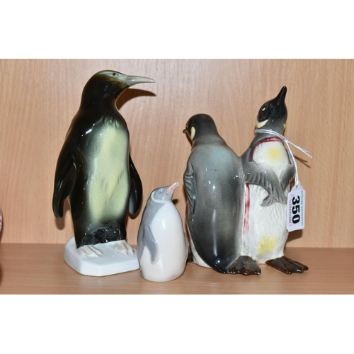 350 - THREE CERAMIC PENGUIN FIGURES, comprising a Beswick Courting Penguins figure group, model no 1015, a... 