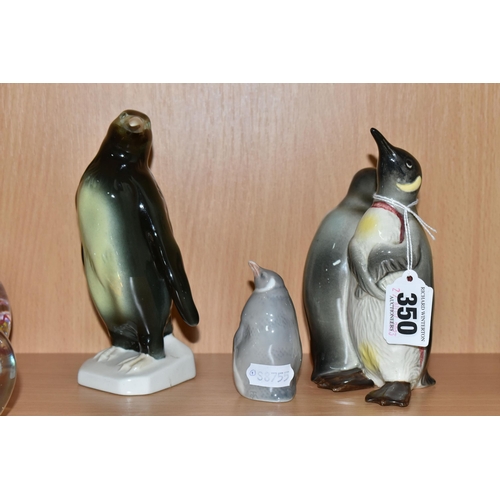 350 - THREE CERAMIC PENGUIN FIGURES, comprising a Beswick Courting Penguins figure group, model no 1015, a... 