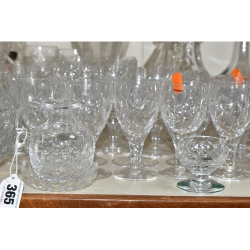 365 - A QUANTITY OF CUT CRYSTAL, over fifty pieces to include twelve decanters, a large geometric vase, a ... 