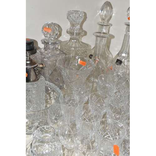 365 - A QUANTITY OF CUT CRYSTAL, over fifty pieces to include twelve decanters, a large geometric vase, a ... 