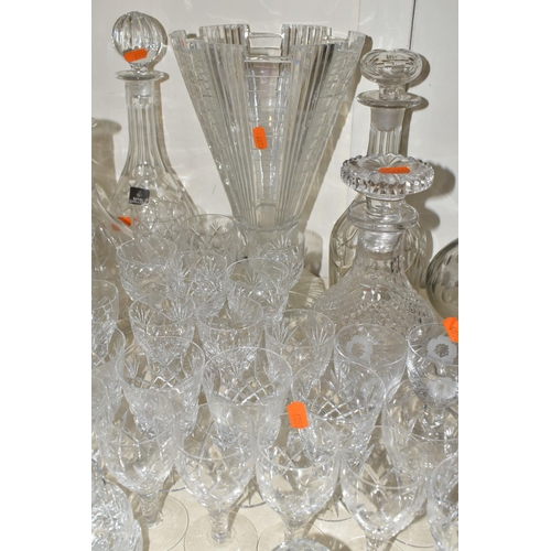 365 - A QUANTITY OF CUT CRYSTAL, over fifty pieces to include twelve decanters, a large geometric vase, a ... 