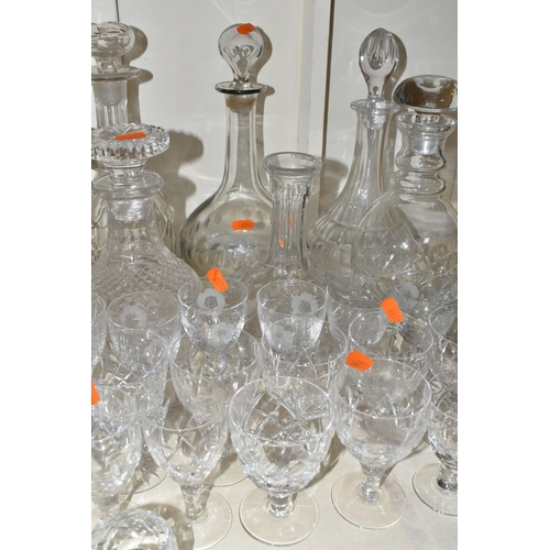 365 - A QUANTITY OF CUT CRYSTAL, over fifty pieces to include twelve decanters, a large geometric vase, a ... 