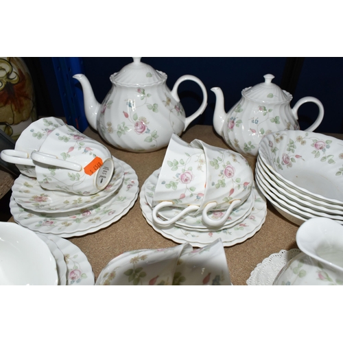 374 - A WEDGWOOD 'ROSEHIP' PATTERN TEA SET,  comprising teapot, milk jug, sugar bowl, a small teapot, milk... 