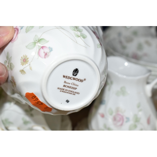 374 - A WEDGWOOD 'ROSEHIP' PATTERN TEA SET,  comprising teapot, milk jug, sugar bowl, a small teapot, milk... 