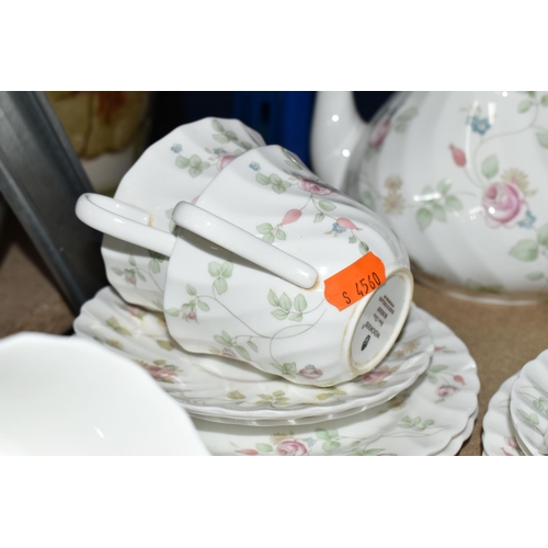 374 - A WEDGWOOD 'ROSEHIP' PATTERN TEA SET,  comprising teapot, milk jug, sugar bowl, a small teapot, milk... 