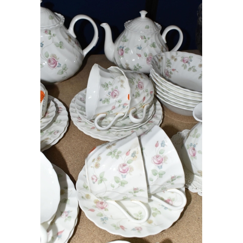 374 - A WEDGWOOD 'ROSEHIP' PATTERN TEA SET,  comprising teapot, milk jug, sugar bowl, a small teapot, milk... 