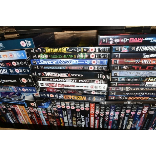 395 - FOUR BOXES OF DVD FILMS, over two hundred, to include mostly World Wrestling Championships and Wrest... 