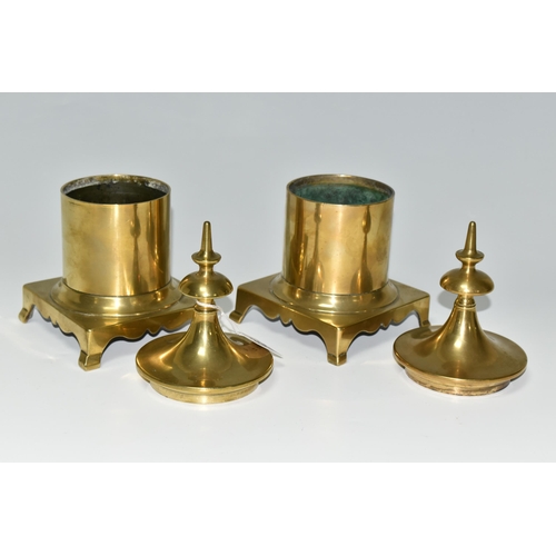 399 - TWO BRASS TOBACCO JARS, with covers, the jars of cylindrical form supported on four feet, height 23c... 