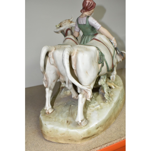 419 - A ROYAL DUX FIGURE OF A WOMAN LEADING OXEN, signed in mould 'Dobrich', bearing pink triangle backsta... 